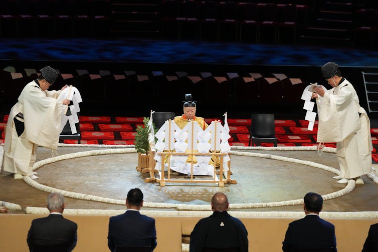 Sumo referees perform the Shinto ritual to purify and bless the ring ahead of a tournament at the Royal Albert Hall in London on Oct. 15, 2025. AP Photo/Frank Augstein